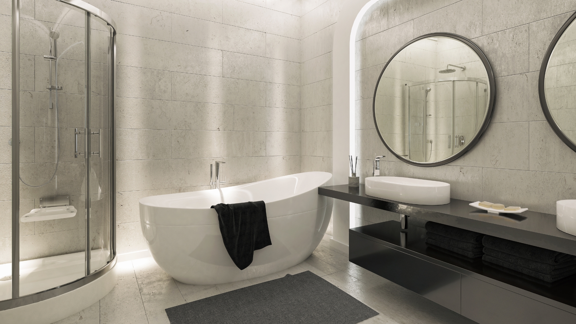 Modern bath remodeling featuring double vanity and round mirrors with freestanding tub and glass shower enclosure