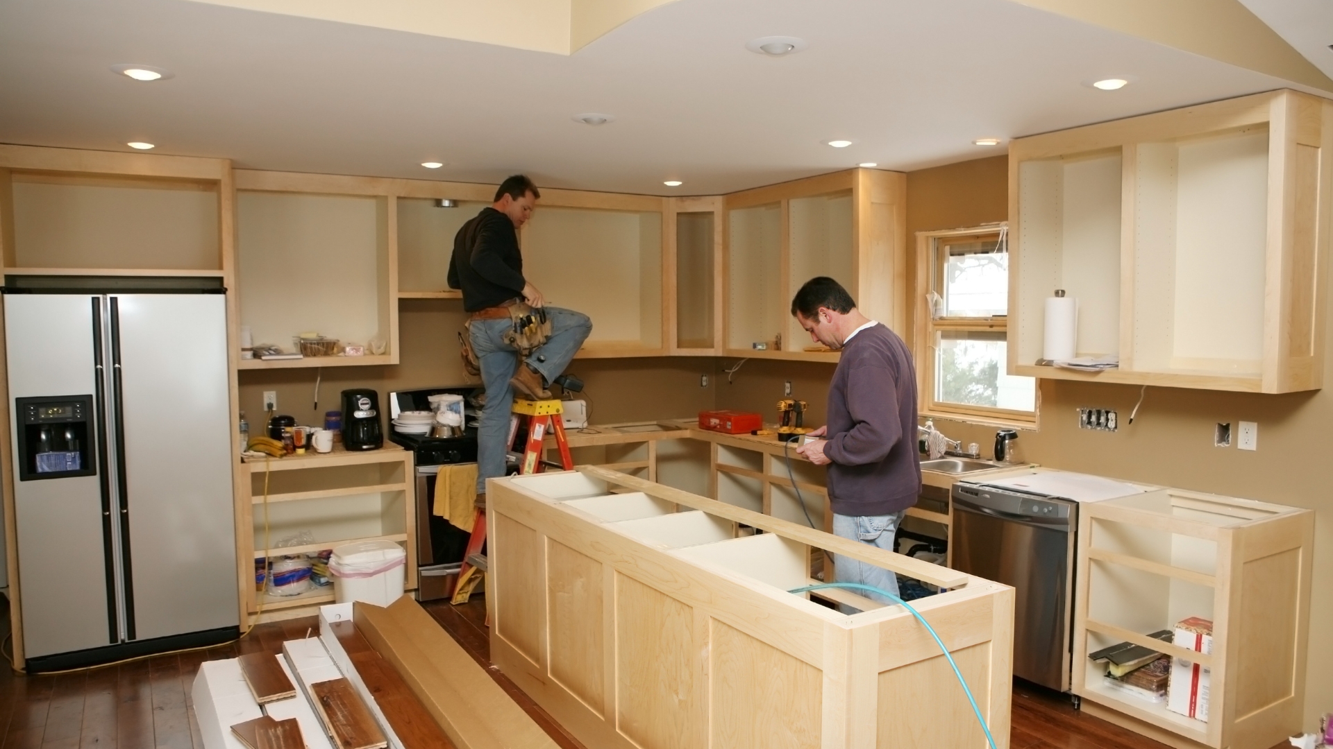 Remodeling service Los Angeles professionals renovating a kitchen with new cabinetry and tools on site
