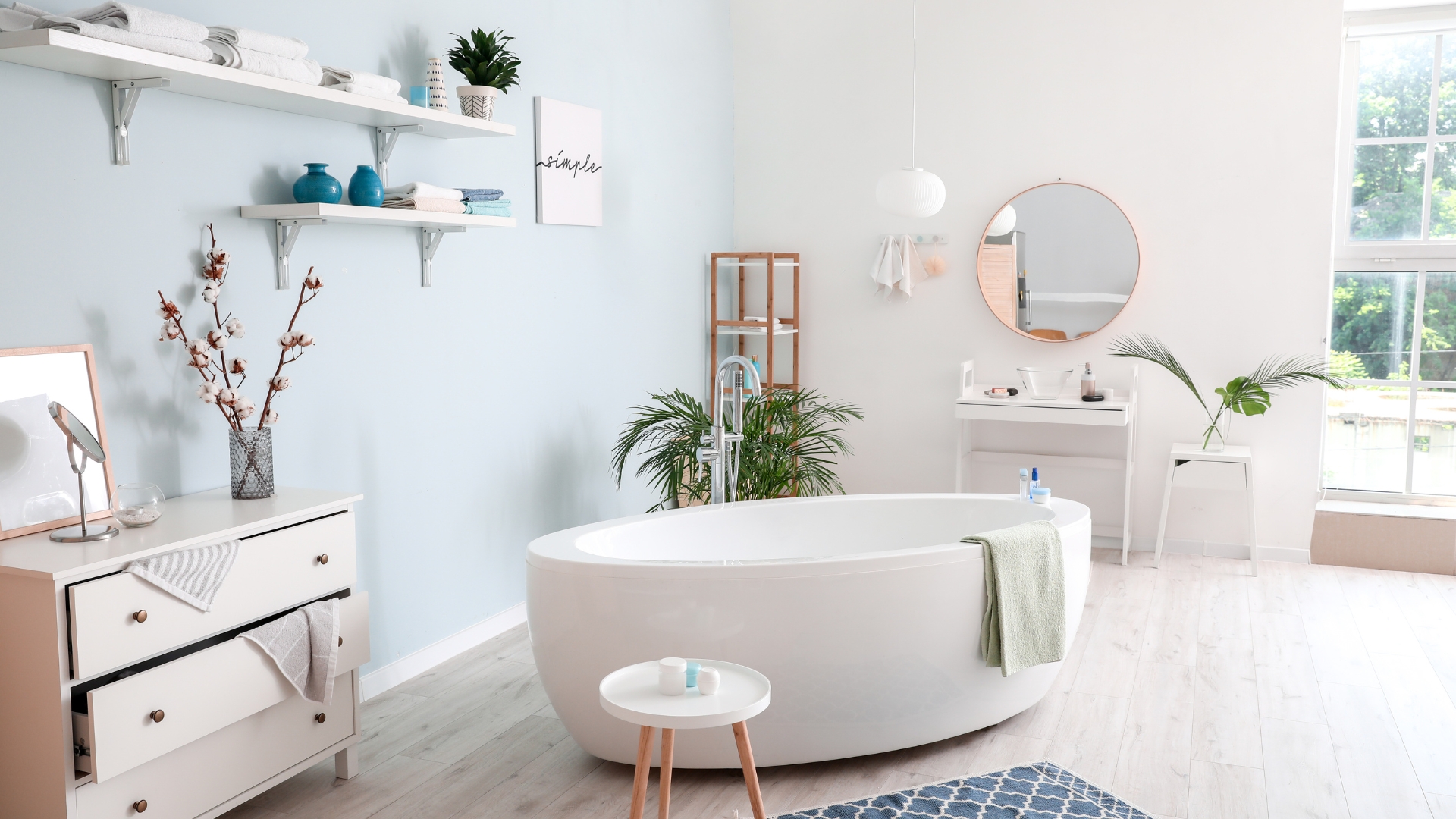 Los Angeles bathroom renovation featuring a freestanding tub, soft pastel tones, and natural wood finishes