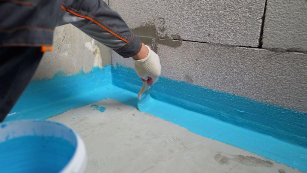 Waterproofing bathroom foundation with brush-on sealant to prevent future water seepage.